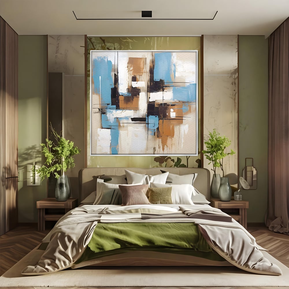 Tablou canvas cu pictura abstracta cu forme geometrice albastre, in rama de aluminiu argintiu, pe perete intr-un dormitor